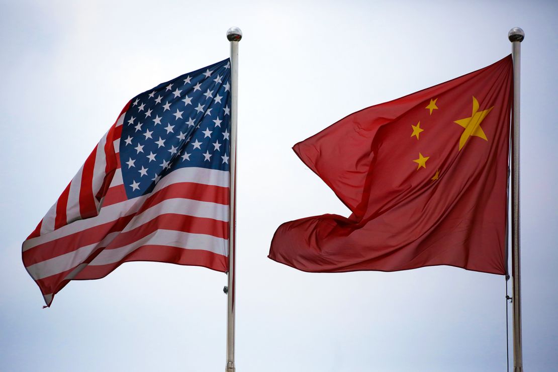 US and Chinese national flags flying outside a building in Shanghai in a file photo.