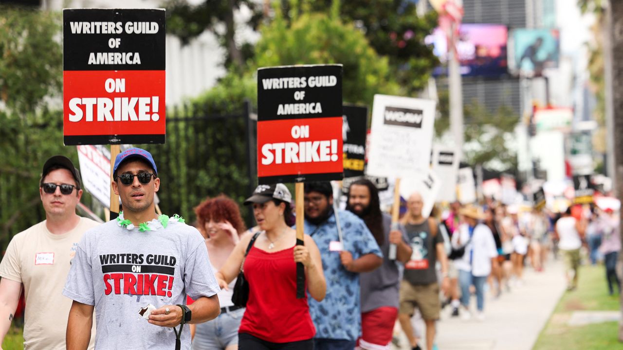 SAG-AFTRA actors and Writers Guild of America (WGA) writers walk the picket line during their ongoing strike, outside Netflix offices in Los Angeles on August 9.