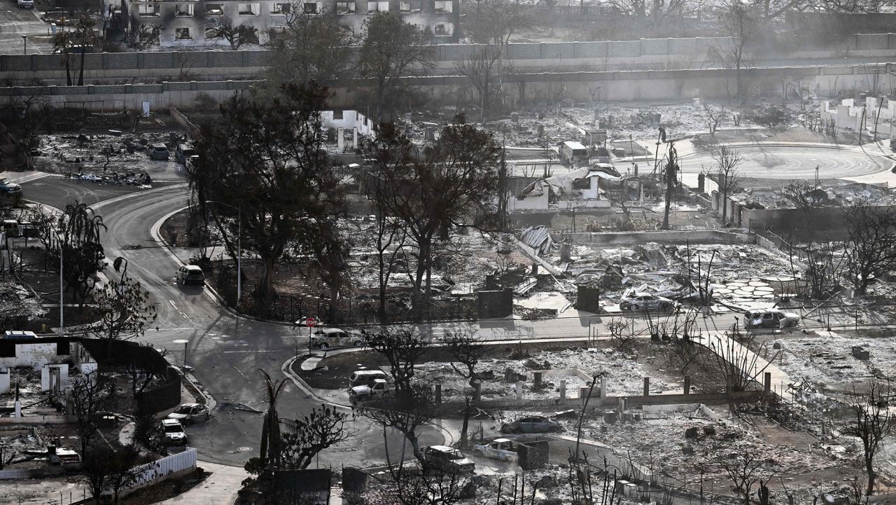 An aerial image taken on August 10, 2023 shows destroyed homes and buildings burned to the ground in Lahaina in the aftermath of wildfires in western Maui, Hawaii. At least 36 people have died after a fast-moving wildfire turned Lahaina to ashes, officials said August 9, 2023 as visitors asked to leave the island of Maui found themselves stranded at the airport. The fires began burning early August 8, scorching thousands of acres and putting homes, businesses and 35,000 lives at risk on Maui, the Hawaii Emergency Management Agency said in a statement. 