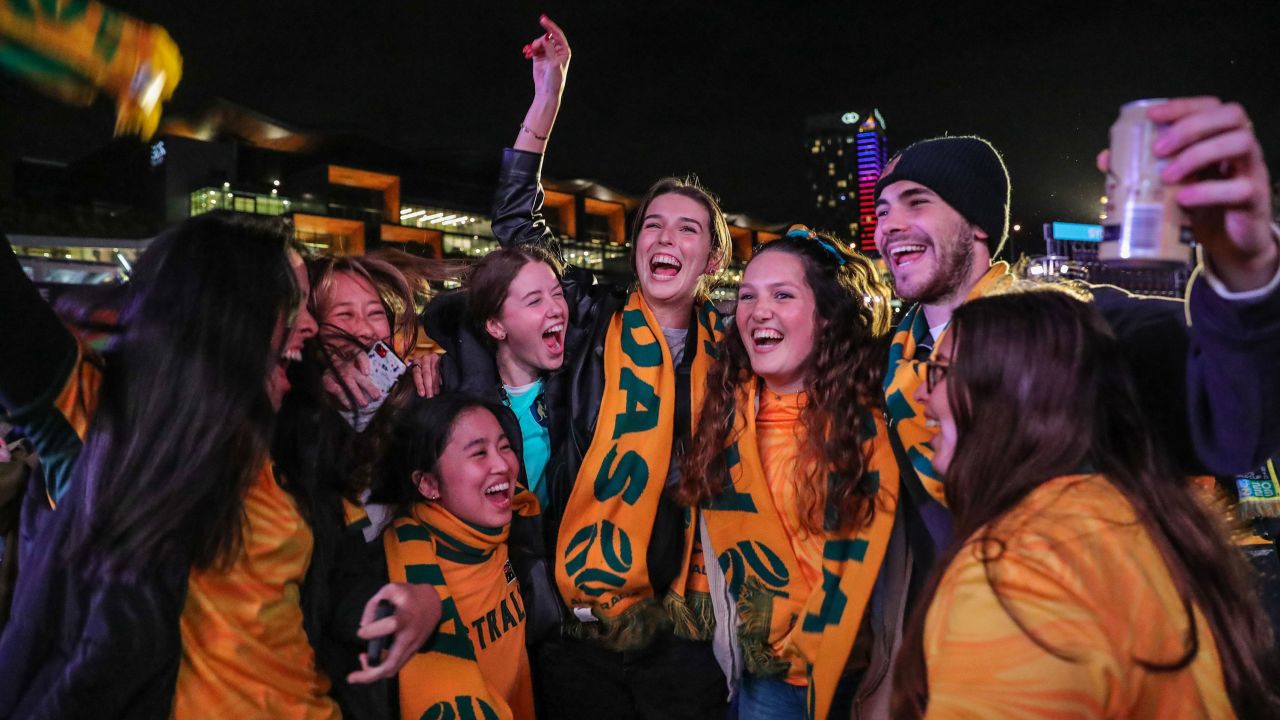Fans at Sydney's FIFA Fan Site celebrate after watching the Matildas win their round of 16 match against Denmark on August 7.