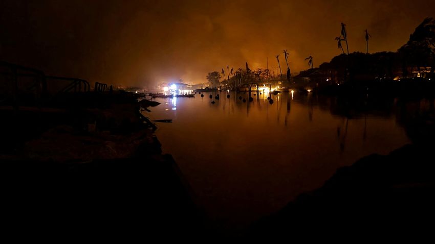 Flames billow near Lahaina as wildfires driven by high winds destroy a large part of the historic town of Lahaina, Hawaii, U.S. August 9, 2023. Dustin Johnson/Handout via REUTERS THIS IMAGE HAS BEEN SUPPLIED BY A THIRD PARTY. REFILE - REMOVING KAHULUI
