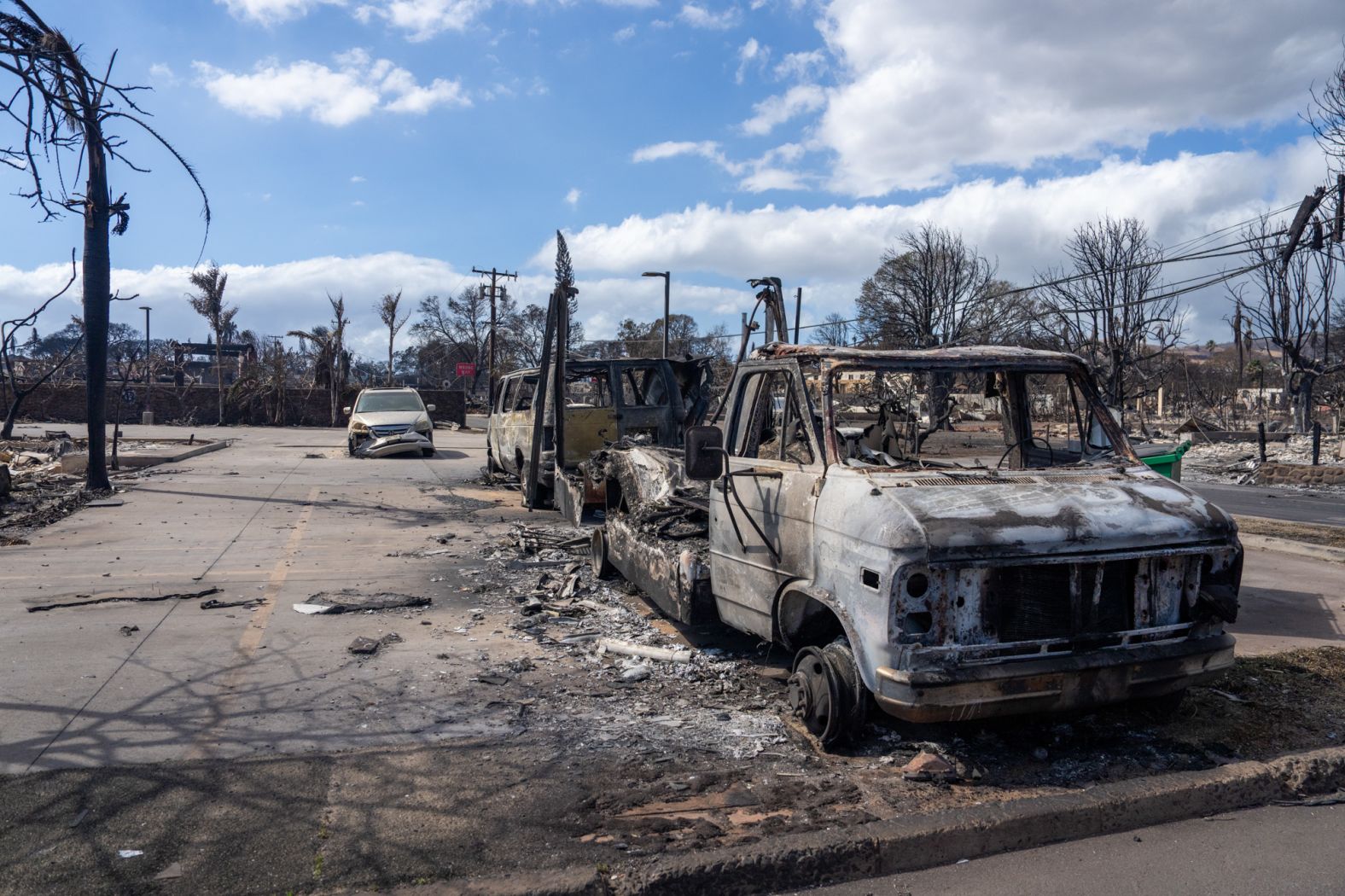 Burned cars sit in Lahaina on August 10.