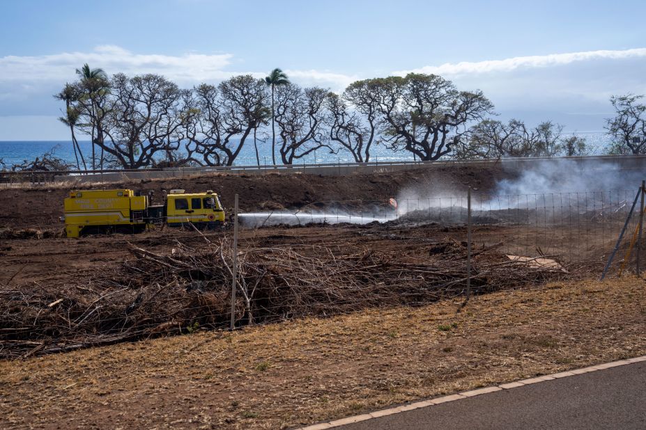 A Maui County Fire Department truck puts out remaining flames in Lahaina, Hawaii, on Thursday.