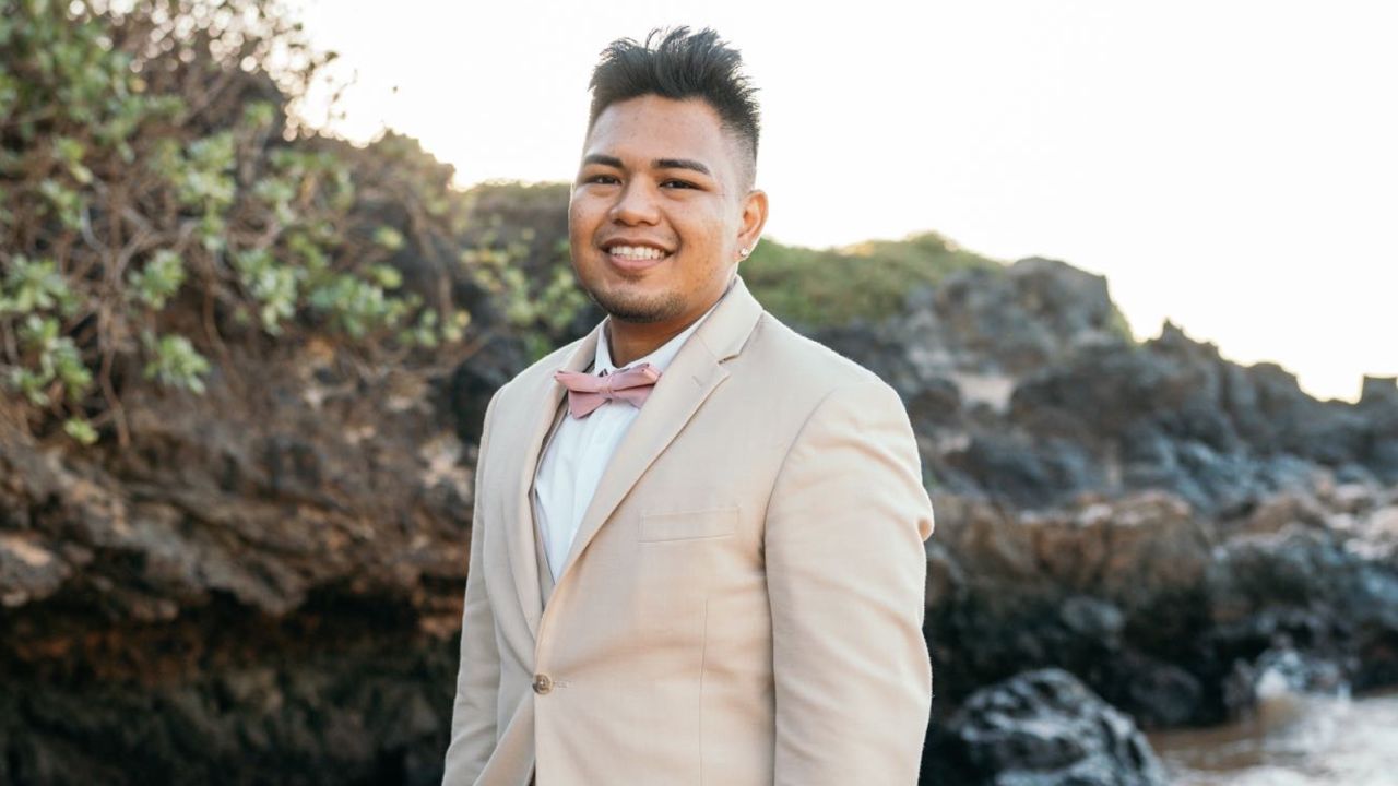 Bryan Aguiran poses on a beach in Lahaina before the wildfire tore apart his community.