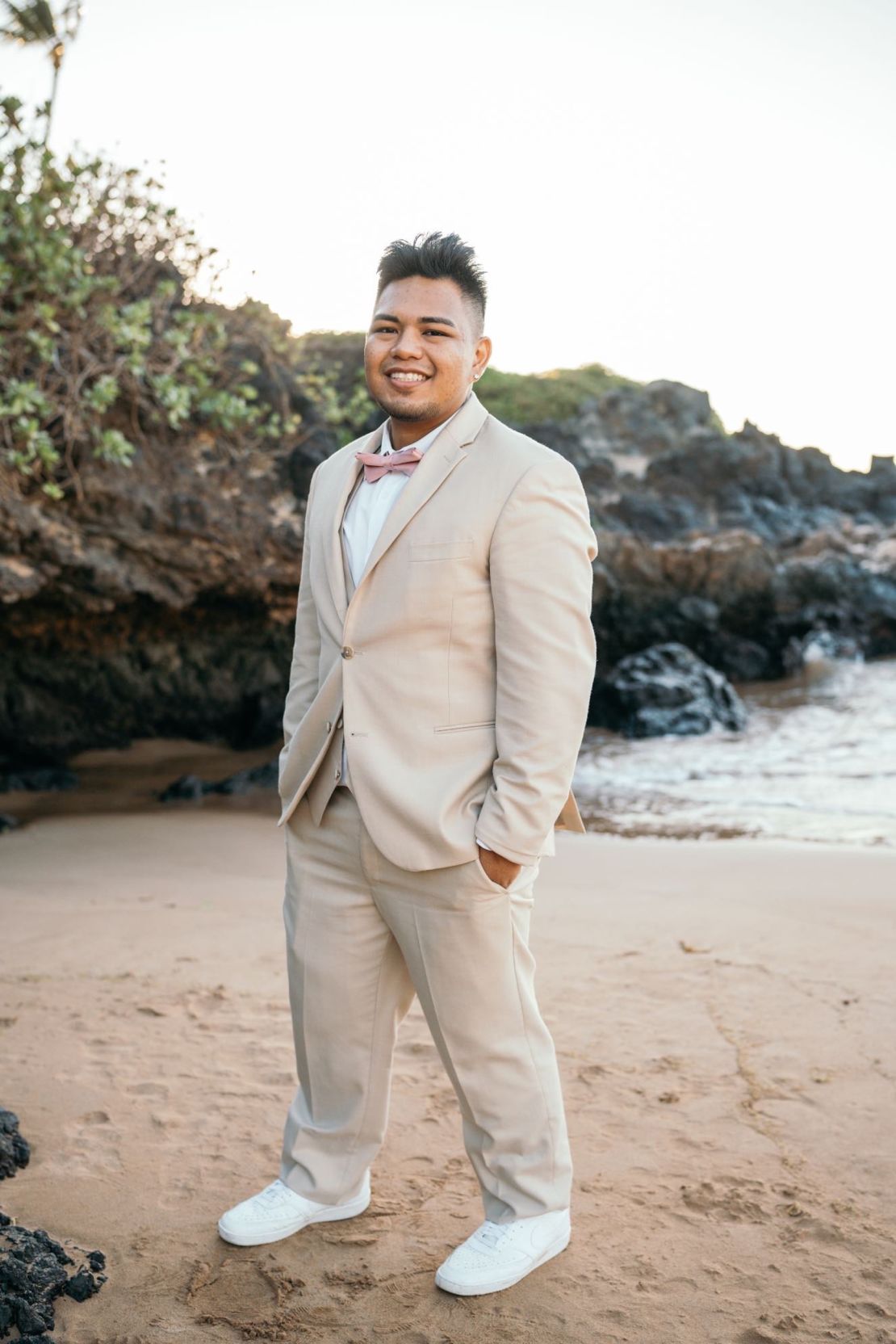 Bryan Aguiran poses on a beach in Lahaina before the wildfire tore apart his community.