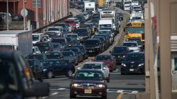 Vehicles approach the Holland Tunnel in Jersey City, New Jersey, US, on Wednesday, July 26, 2023. New York's plan to charge drivers entering midtown Manhattan is a brazen money grab, New Jersey's senior US senator said after the Garden State sued to block the congestion pricing proposal. 