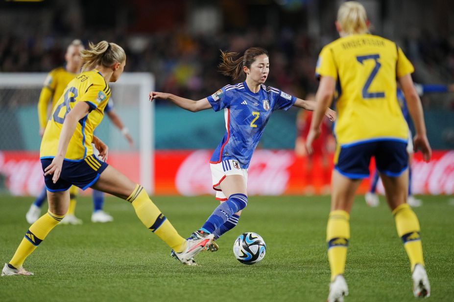 Japan's Risa Shimizu dribbles the ball during the match against Sweden.