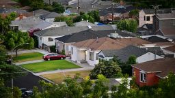 Green grass lawns seen in front of homes in a Los Angeles, California neighborhood on July 5, 2022.