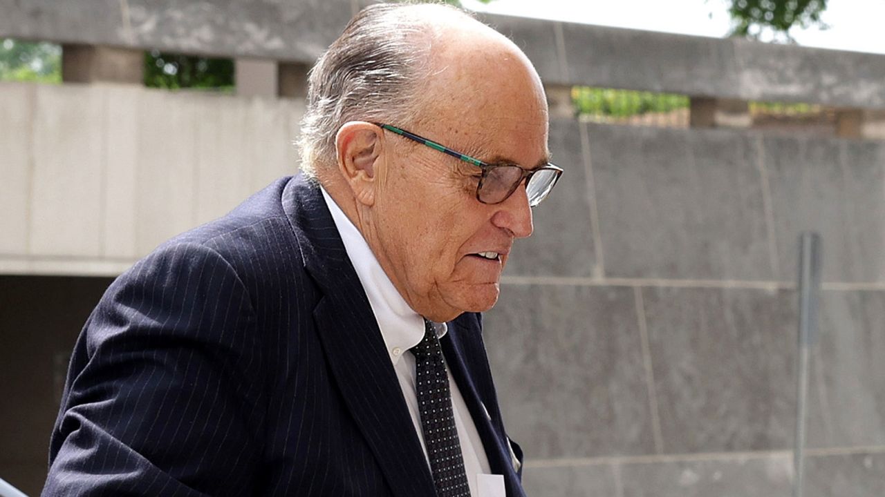 WASHINGTON, DC - MAY 19: Former New York City Mayor and former personal lawyer for President Donald Trump, Rudy Giuliani (R), arrives at the U.S. District Court on May 19, 2023 in Washington, DC. Giuliani is sued by election workers Ruby Freeman and Shaye Moss of Fulton County, Georgia, for defamation. (Photo by Alex Wong/Getty Images)