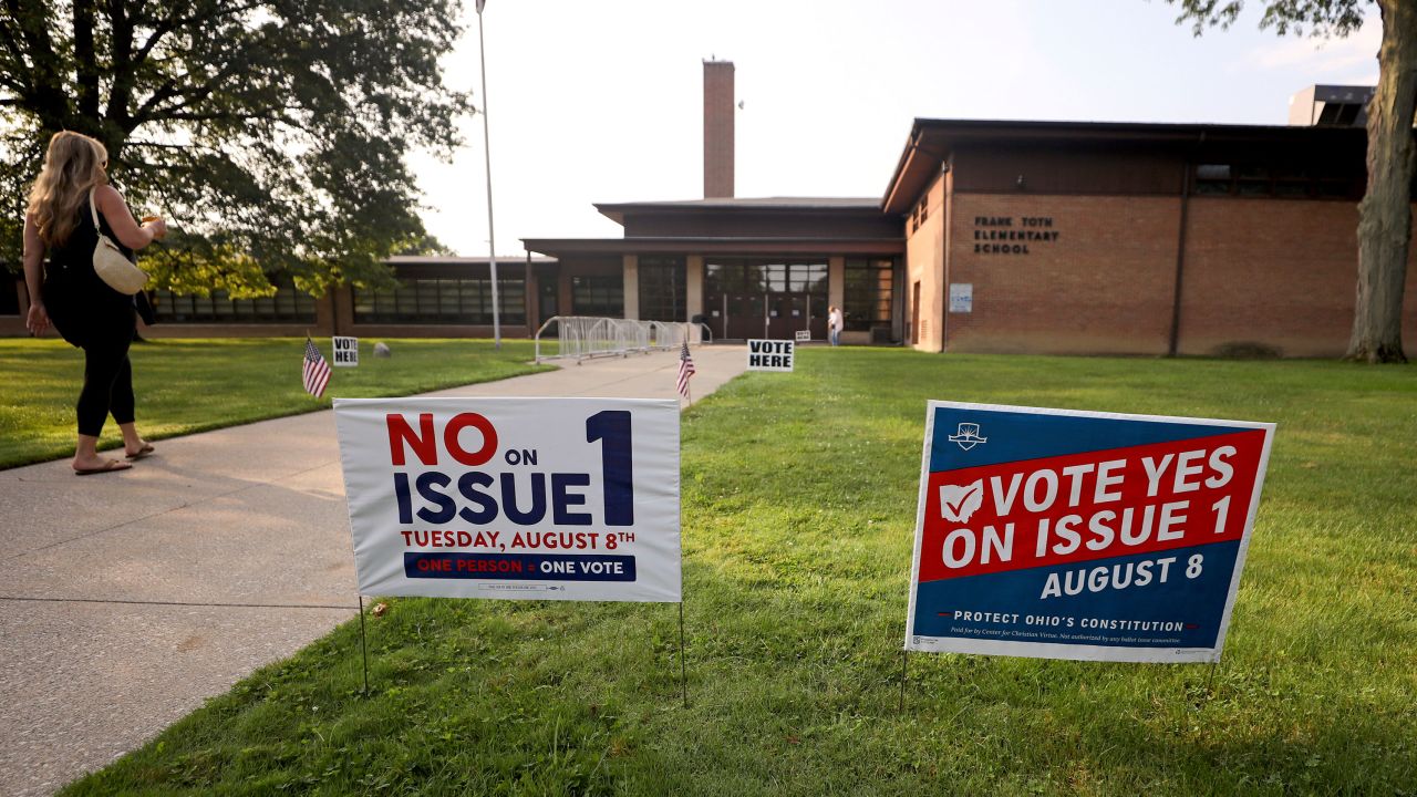 Opposing signs on the ballot measure are posted outside a polling site in Perrysburg, Ohio, on August 11, 2023. 