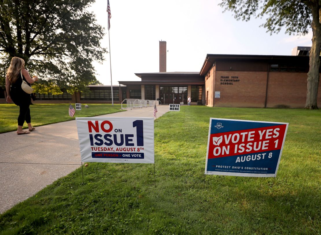 Opposing signs on the ballot measure are posted outside a polling site in Perrysburg, Ohio, on August 11, 2023. 
