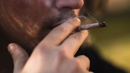 Man smoking a marijuana joint