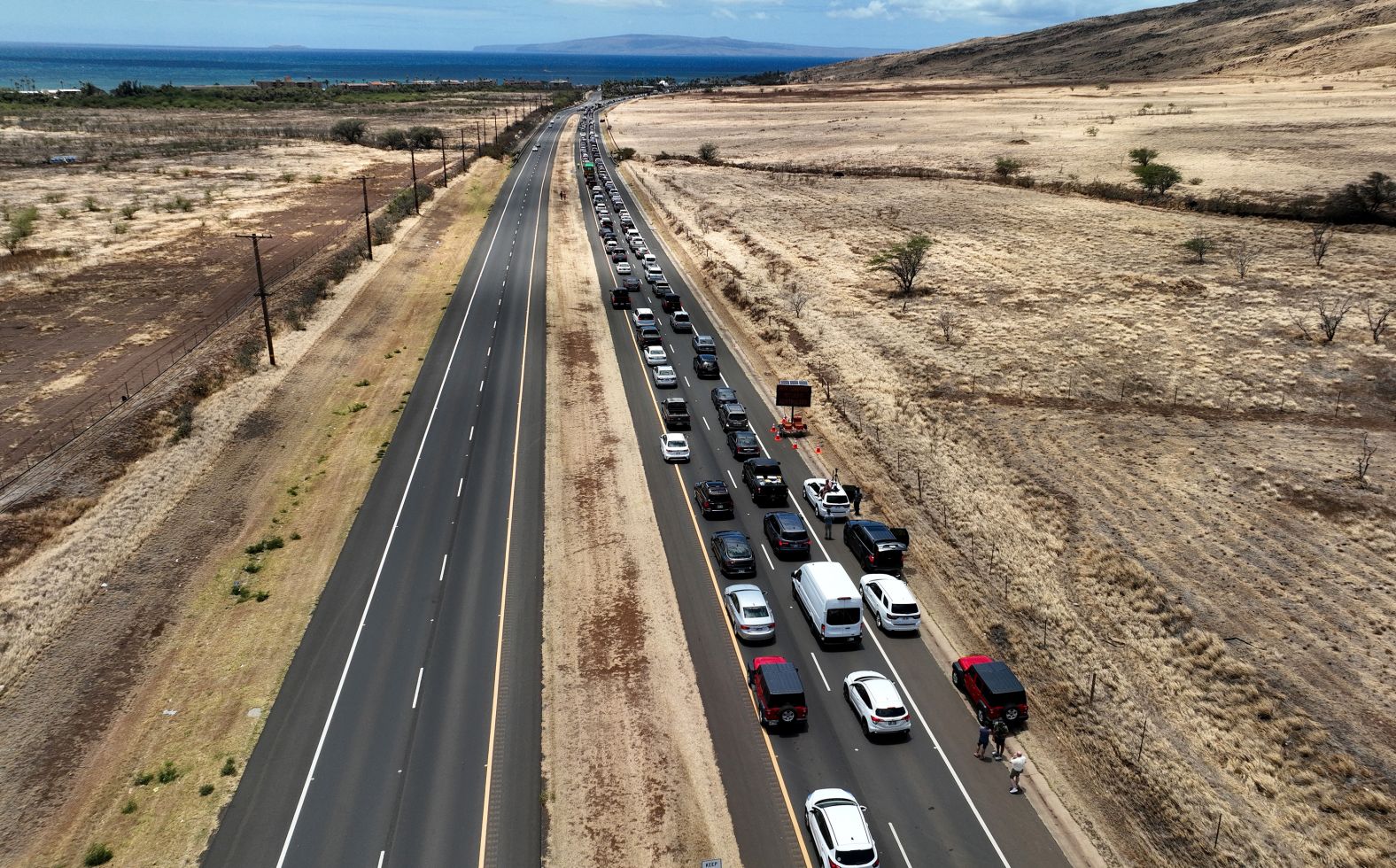 Cars are backed up on the Honoapiilani Highway as residents are allowed back into wildfire-affected areas on August 11.