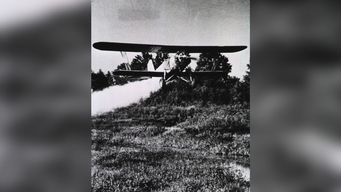 An airplane spraying insecticide in an effort to kill malaria mosquitos in 1930.