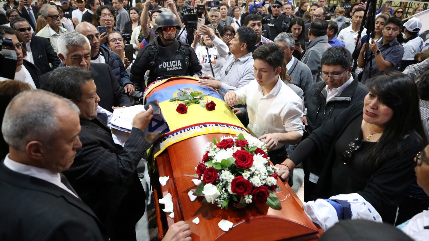 Friends, family members and supporters of Ecuadorean presidential candidate Fernando Villavicencio attend a post-mortem tribute at Quito Exhibition Center on August 11.