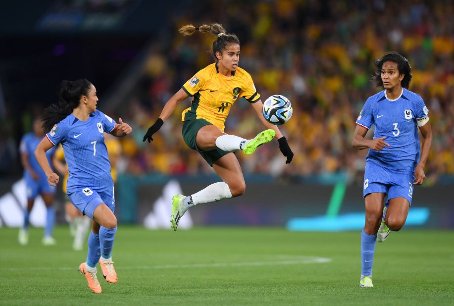 Australia's Mary Fowler controls the ball between France's Sakina Karchaoui and Wendie Renard.