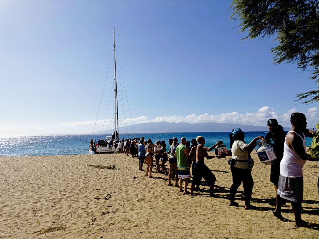 Supplies are being unloaded onto Kahekili Beach Park from the Ocean Spirit, just north of Lahaina.