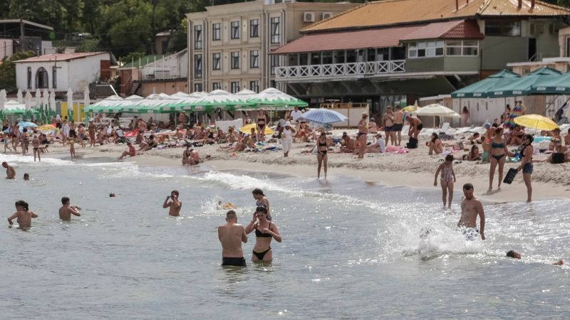 NextImg:No bathing during air raids - but beaches in southern Ukraine port reopen | CNN