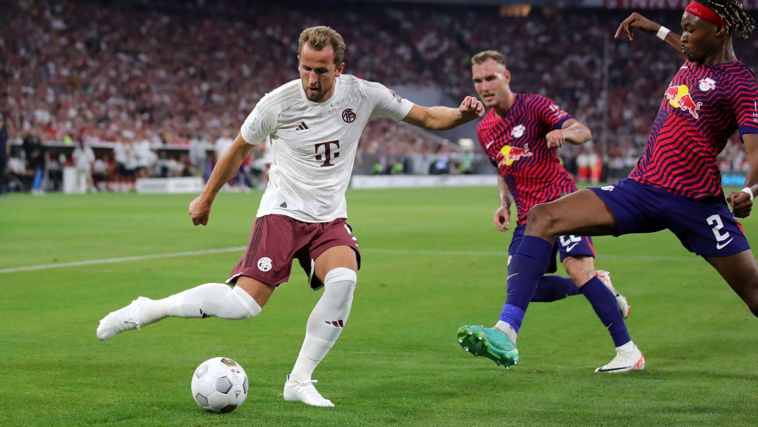 Harry Kane vies with Mohamed Simakan of RB Leipzig during the DFL Supercup 2023 match at Allianz Arena on August 12, 2023, in Munich, Germany.