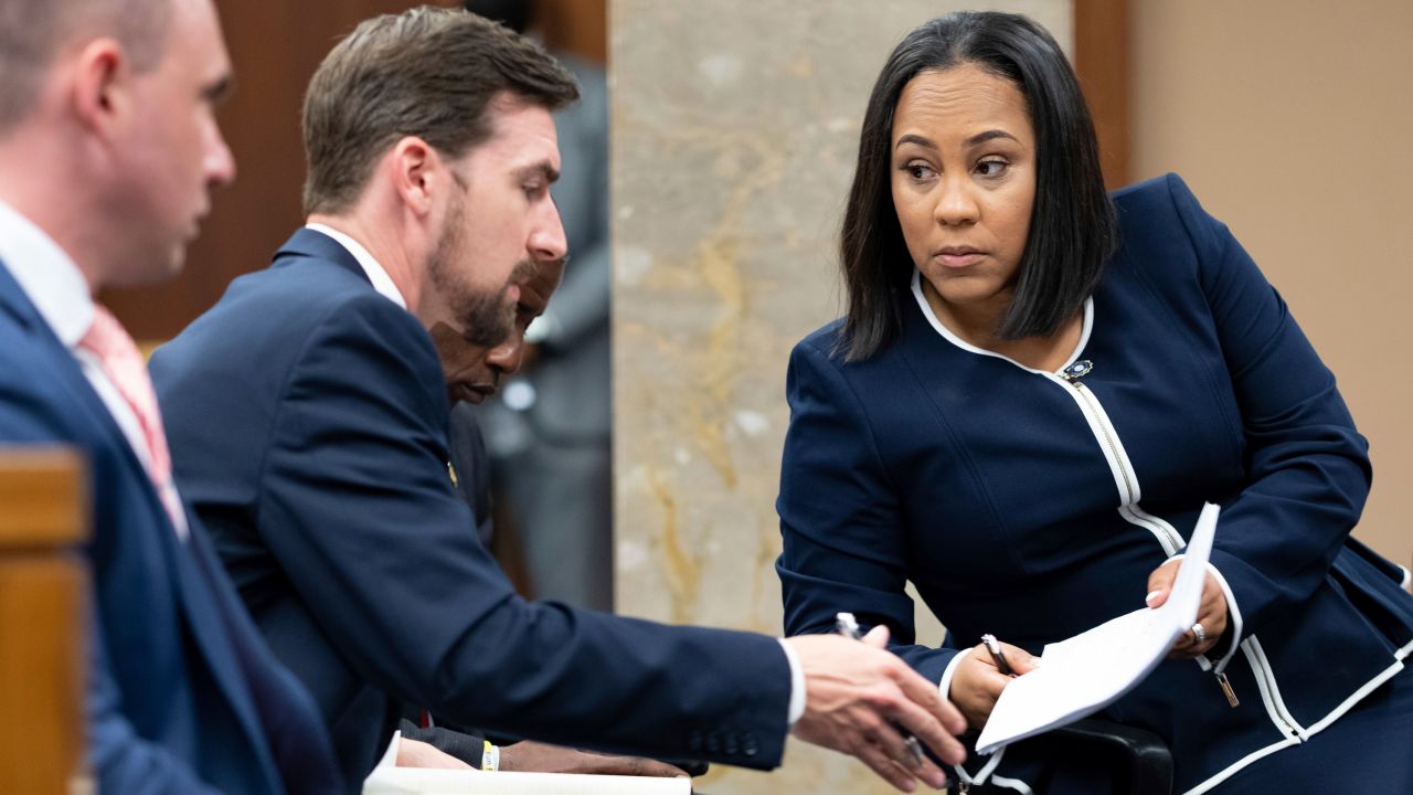 Willis speaks with her team on May 2, 2022,  during proceedings in Atlanta to seat a special purpose grand jury to look into the 2020 election subversion case.