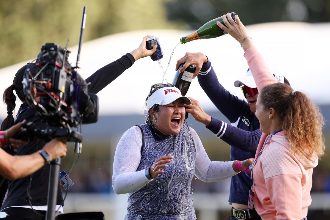 Lilia Vu of the United States celebrates as drinks are poured on her on the 18th green on Day Four of the AIG Women's Open at Walton Heath Golf Club on August 13, 2023 in Tadworth, England.