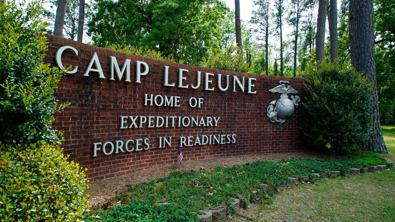 FILE - Signage stands on the main gate to Camp Lejeune Marine Base outside Jacksonville, N.C., April 29, 2022. Three U.S. Marines found unresponsive in a car at a North Carolina gas station died of carbon monoxide poisoning, the local sheriff's office said Wednesday, July 26, 2023. (AP Photo/Allen G. Breed, File)