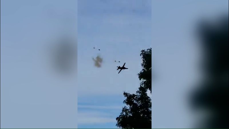 Video captures moment two people eject from plane just before it crashes at air show