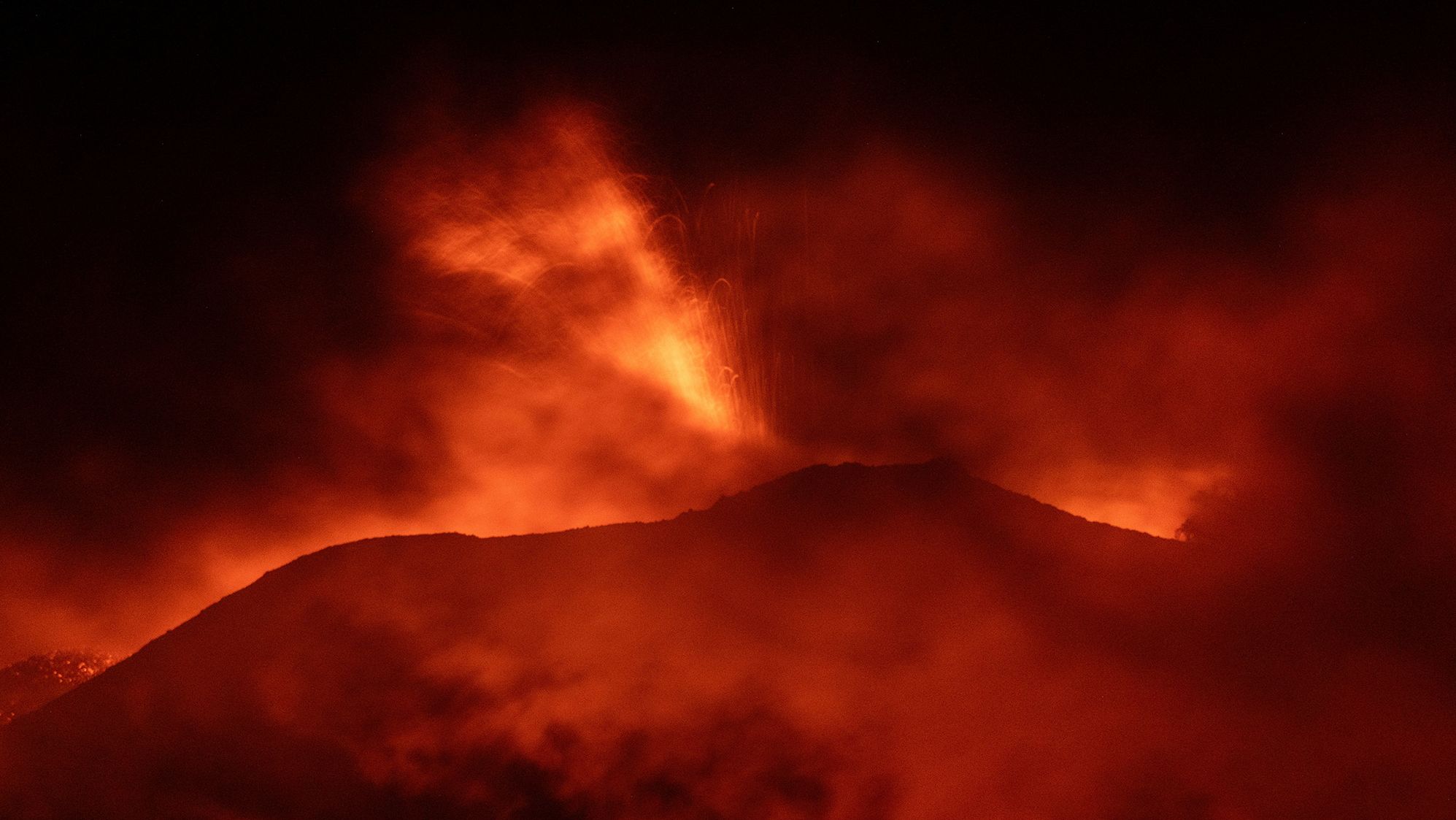 Mount Etna, Europe's most active volcano, lights up the night sky with eruptions as seen from Rocca Della Valle, Italy, August 13, 2023. Etna Walk/Marco Restivo/ Handout via REUTERS ATTENTION EDITORS - THIS IMAGE HAS BEEN SUPPLIED BY A THIRD PARTY.
