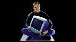 Feb. 19, 1999 - Cupertino, California, U.S. - Apple founder and current chief STEVE JOBS, cross legged and smiling as he holds the iMac that has become the hottest-selling computer on the market. The computer now comes in five fruit-inspired colors including blueberry and strawberry. Shown is the original Bondai Blue color. (Credit Image: © Apple Computer/ZUMAPRESS.com)