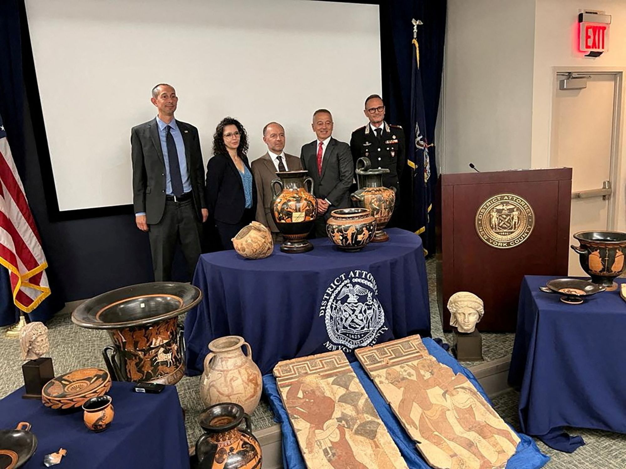 Deputy Special Agent in Charge at Homeland Security Investigation NY, Mike Alfonso, First Legal Secretary of Manhattan District Attorney's Office, Gloria Garcia, Italy's Console, Cesare Bieller, Assistant District Attorney NY, Colonel Matthew Bogdanos, Commander of Carabinieri TPC General Vincenzo Molinese, present some of the antiquities returned to Italy from U.S. during a ceremony in New York, U.S., August 8, 2023.