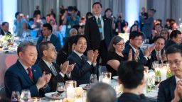 Taiwan's Vice President William Lai applauds next to Ingrid D. Larson, Managing Director of the American Institute in Taiwan, while attending a luncheon in New York City, New York, U.S., in this handout picture released on August 14, 2023.
