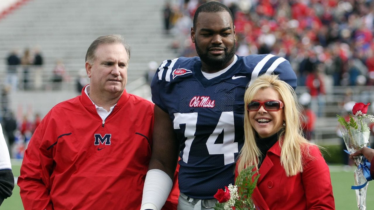 Michael Oher stands with his family during senior ceremonies prior to a game on November 28, 2008, in Oxford, Mississippi.