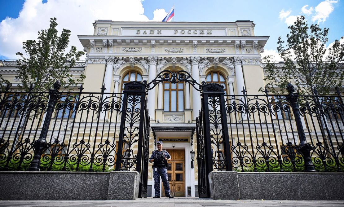 A police officer guards the entrance of the Russian Central Bank headquarters in downtown Moscow on July 21, 2023. The Russian Central Bank on July 21, 2023 hiked its key rate to 8.5 percent, a first since September last year, amid fears that a weakening ruble will drive up inflation in the country. 