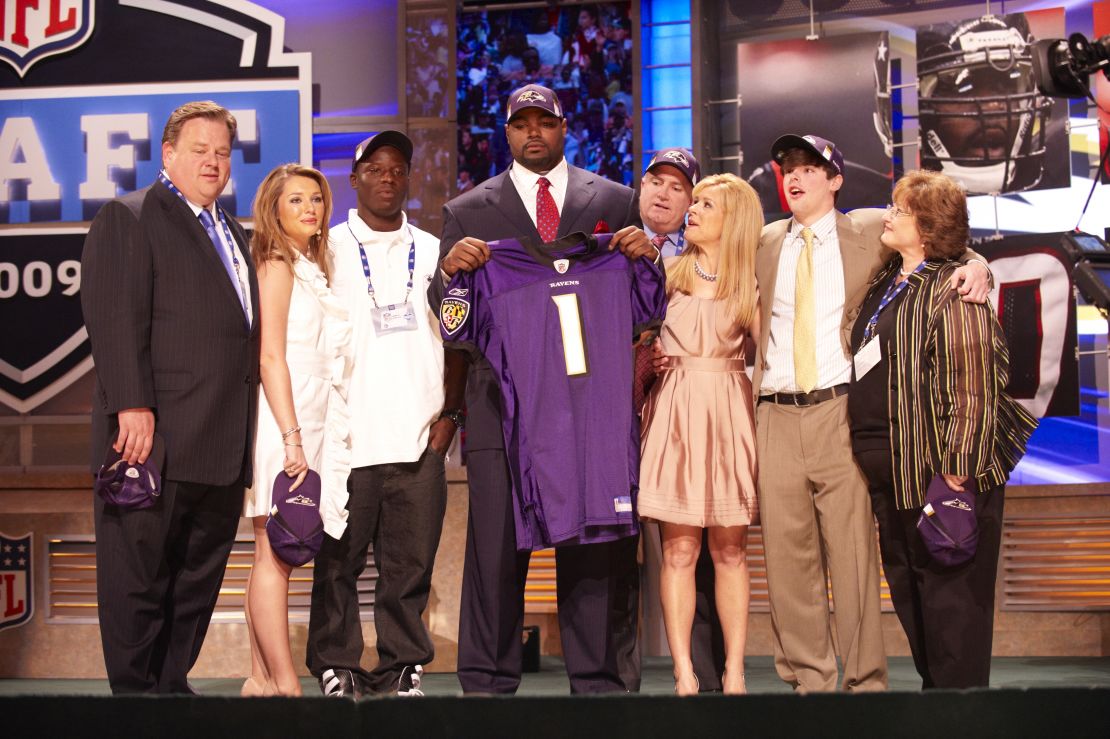Michael Oher posed with the Tuohy family and others when he was drafted by the Baltimore Ravens in the first round of the 2009 NFL Draft.