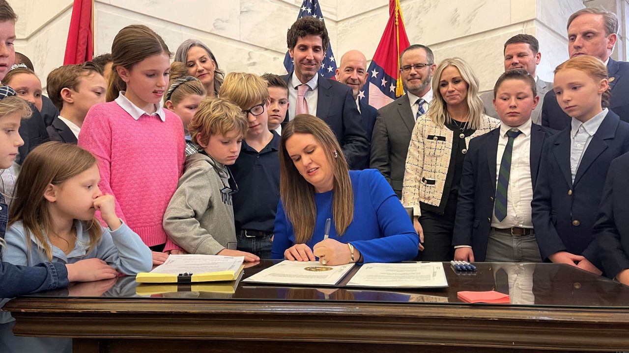 Arkansas Gov. Sarah Huckabee Sanders signs into law an education overhaul bill on Wednesday, March 8, 2023 at the state Capitol in Little Rock, Ark. (AP Photo/Andrew DeMillo)
