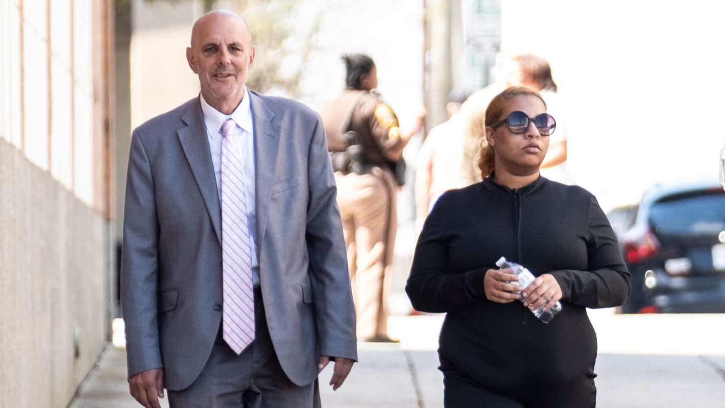 Deja Taylor arrives with attorney James Ellenson at the Newport News Sheriff's Office in April.