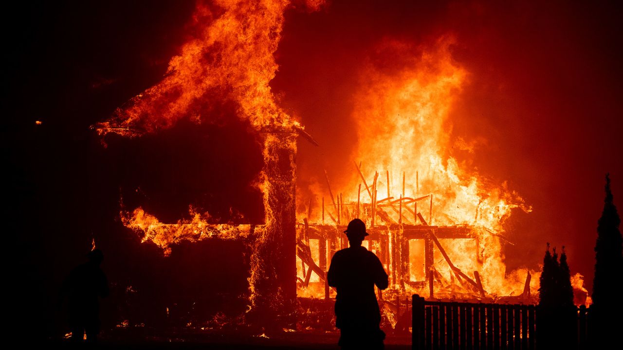 A home burns as the Camp Fire rages through Paradise.