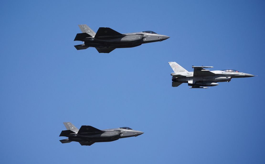 US Air Force F-35 jets and Polish Air Force F-16 jet participate in the military parade.