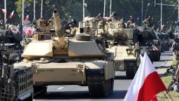 U.S.-made Abrams tanks purchased by Poland take part in a massive military parade to celebrate the Polish Army Day, commemorating the 1920 battle in which Polish troops defeated advancing Bolshevik forces, in Warsaw, Poland, Tuesday, Aug. 15, 2023. Poland is holding a military parade to showcase its state-of-the-art weapons and defense systems, as war rages across its southeastern border in neighboring Ukraine and ahead of parliamentary elections scheduled for Oct. 15. (AP Photo/Czarek Sokolowski)