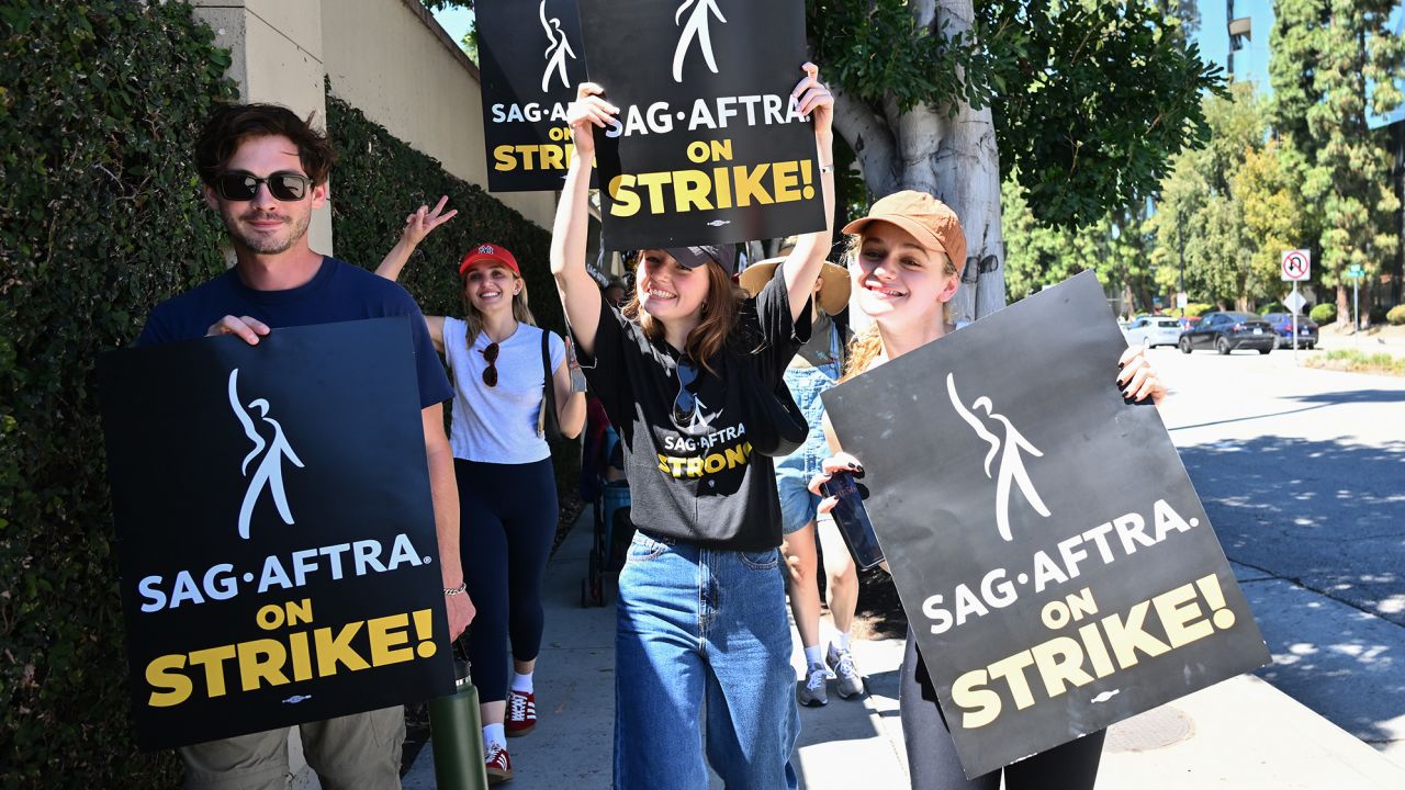 Matt Dallas, Chloe Fineman and Joey King joins SAG-AFTRA and WGA Members and Supporters as they walk the picket line in support of the SAG-AFTRA and WGA strike on Day 2 at the Warner Bros. Studio on July 14, 2023 in Burbank, California. (Photo by Michael Buckner/Variety via Getty Images)
