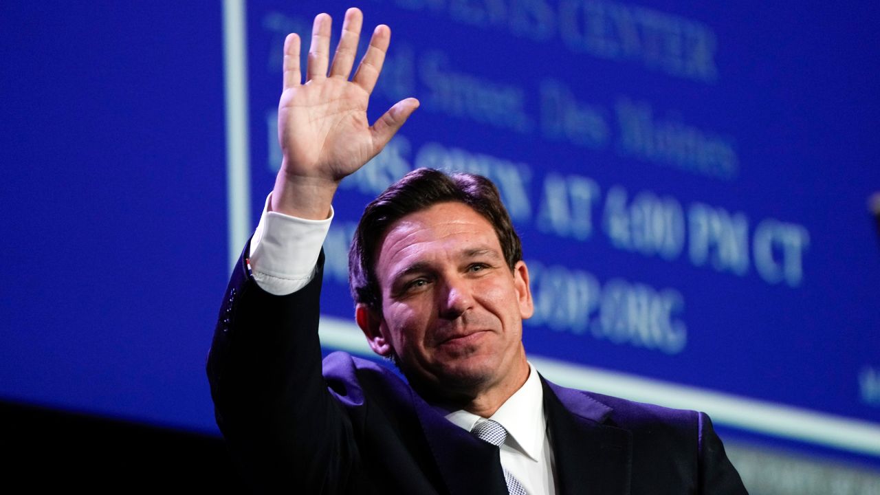 Florida Gov. Ron DeSantis waves at the Republican Party of Iowa's 2023 Lincoln Dinner in Des Moines on July 28, 2023.