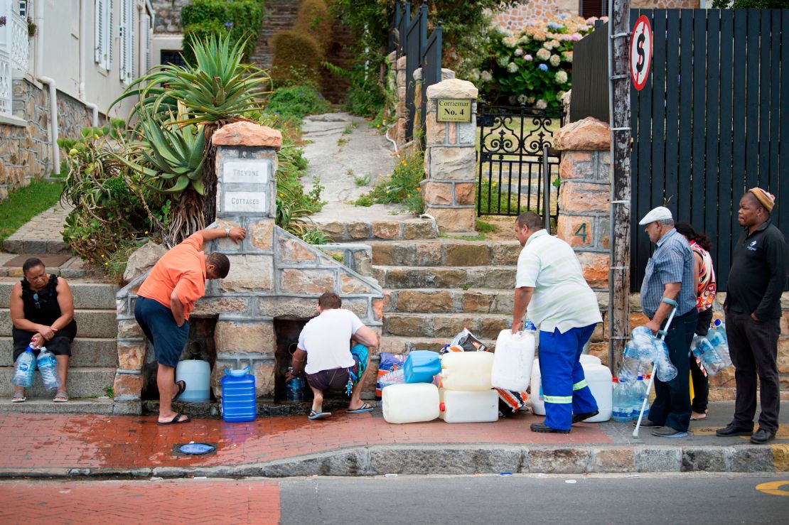 People collect drinking water from in Cape Town on January 19, 2018, during a water crisis which saw the city nearly run dry. 