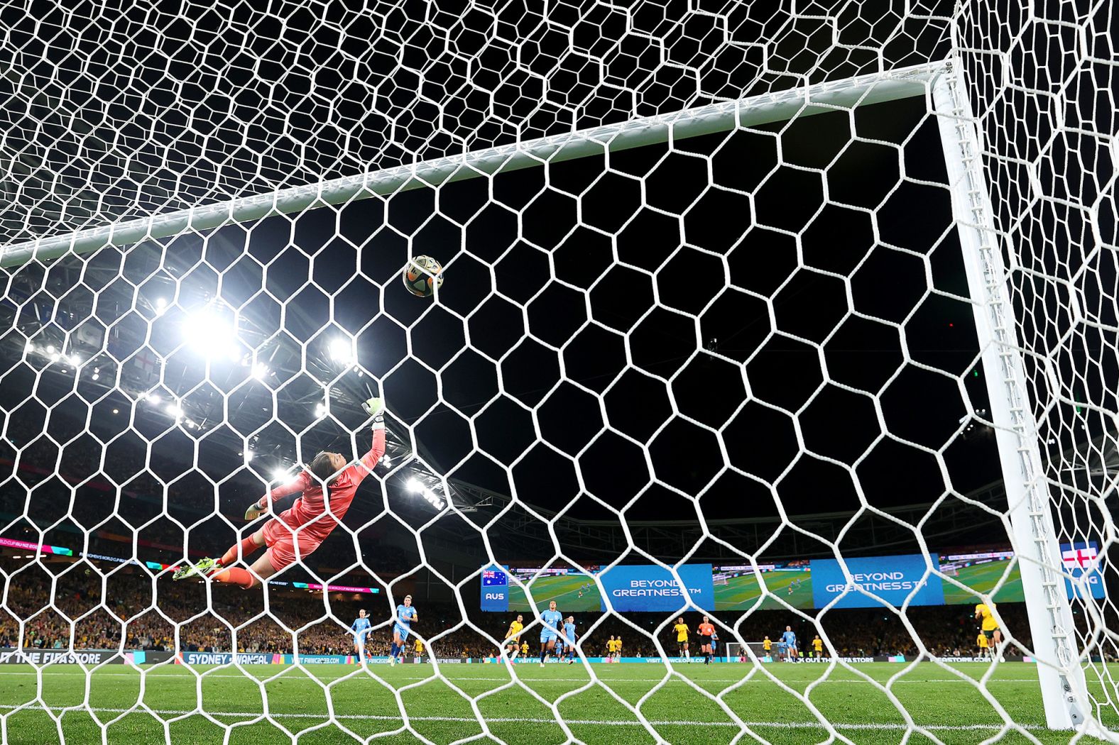 English goalkeeper Mary Earps dives in vain to stop Kerr's rocket from distance — arguably the goal of the tournament.