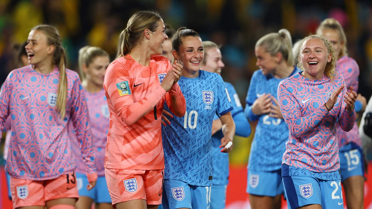 England's players celebrate after the final whistle.