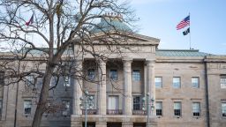 Law enforcement stand guard outside of the state capitol building in downtown Raleigh, North Carolina, on January 17, 2021.