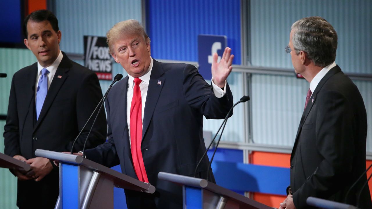 CLEVELAND, OH - AUGUST 06:  Republican presidential candidates (L-R) Wisconsin Gov. Scott Walker, Donald Trump and Jeb Bush participate in the first prime-time presidential debate hosted by FOX News and Facebook at the Quicken Loans Arena August 6, 2015 in Cleveland, Ohio. The top-ten GOP candidates were selected to participate in the debate based on their rank in an average of the five most recent national political polls.  (Photo by Chip Somodevilla/Getty Images)