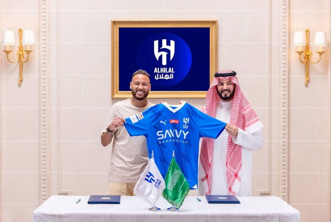 Soccer Football - Neymar signs for Al Hilal - Paris, France - August 15, 2023
Al Hilal's new signing Neymar holds their shirt as he poses with President Fahd bin Saad Al-Nafel
Saudi Pro League/Handout via REUTERS??ATTENTION EDITORS - THIS IMAGE HAS BEEN SUPPLIED BY A THIRD PARTY.
REFILE - CORRECTING CAPTION