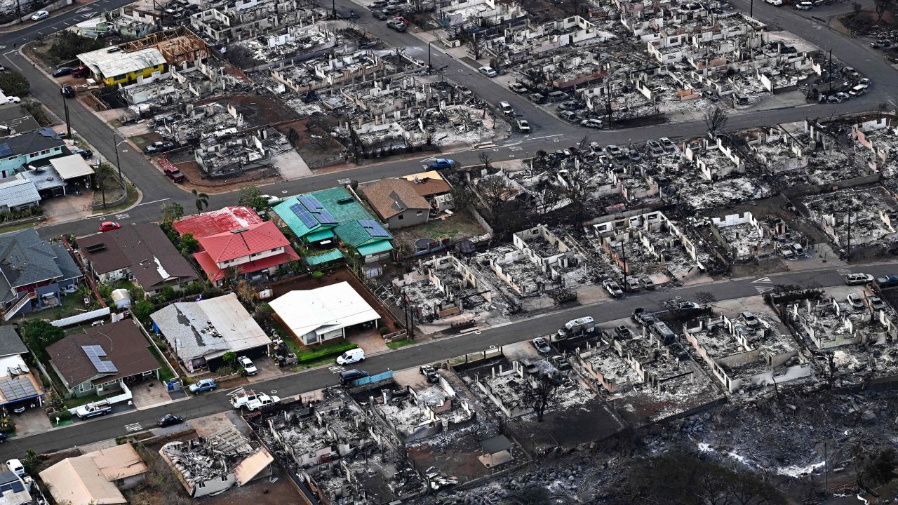 TOPSHOT - An aerial image taken on August 10, 2023 shows destroyed homes and buildings burned to the ground in Lahaina in the aftermath of wildfires in western Maui, Hawaii. At least 36 people have died after a fast-moving wildfire turned Lahaina to ashes, officials said August 9, 2023 as visitors asked to leave the island of Maui found themselves stranded at the airport. The fires began burning early August 8, scorching thousands of acres and putting homes, businesses and 35,000 lives at risk on Maui, the Hawaii Emergency Management Agency said in a statement. (Photo by Patrick T. Fallon / AFP) (Photo by PATRICK T. FALLON/AFP via Getty Images)