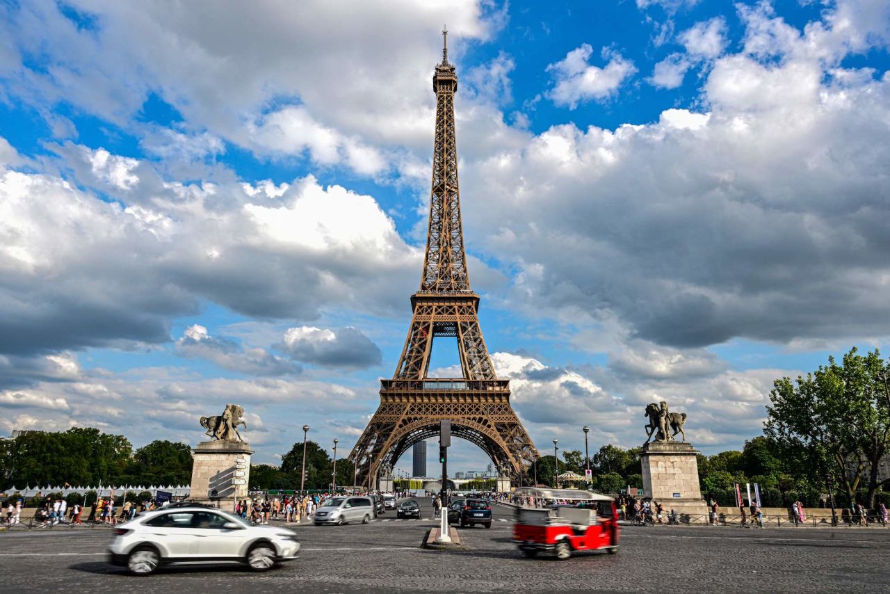 Cars drive past the Eiffel Tower in Paris on August 16, 2023. (Photo by Miguel Medina/AFP) (Photo by Miguel Medina/AFP via Getty Images)