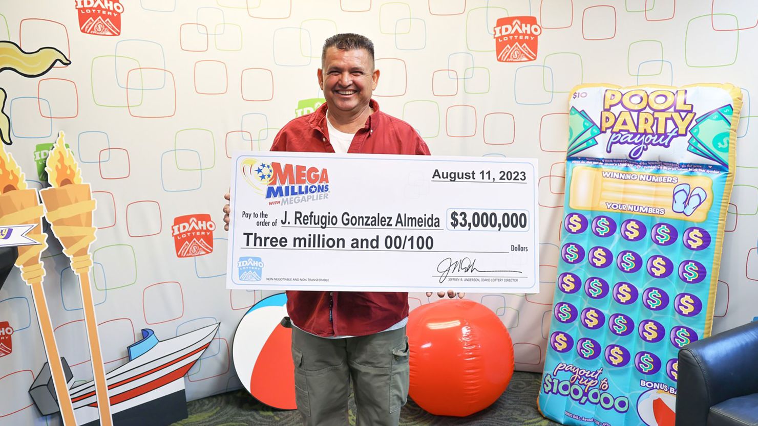 J. Refugio Gonzalez Almeida holds a ceremonial winning check on the Idaho Lottery's Instagram page.